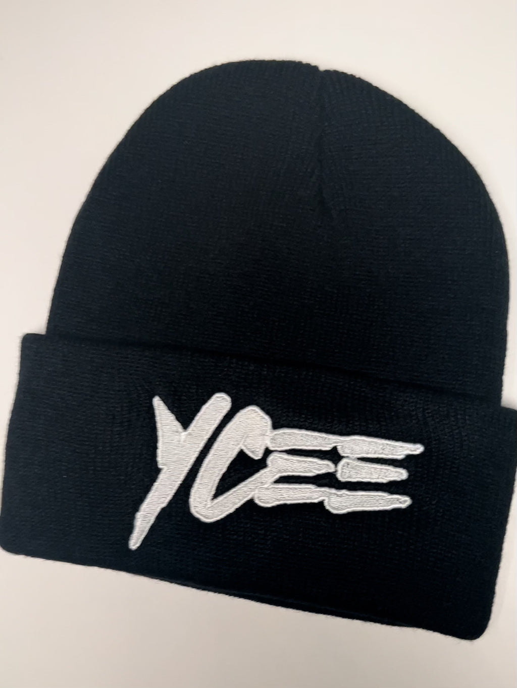 Black beanie with 'Ycee' logo on a white background