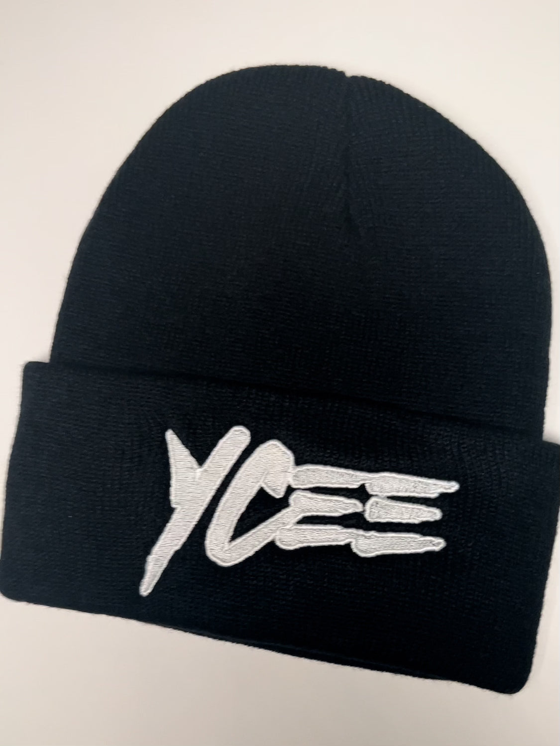 Black beanie with 'Ycee' logo on a white background
